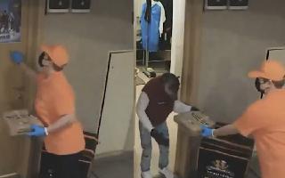 video-of-fullydressed-chimpanzee-receiving-pizza-order-leaves-netizens-in-splits-watch