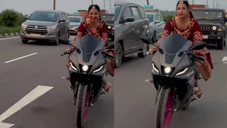 Woman In Full Bridal Attire Rides Bike Without Helmet; Internet Questions Absence Of Safety Gear | Viral Video