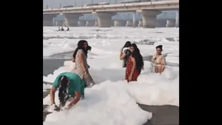 Viral Video Shows Woman ‘Shampooing’ Hair With Yamuna River’s Toxic Foam | Desis React