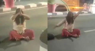 Unusual Scene In Lucknow: Woman Sits In Middle Of Road, Shakes Head For 20 Minutes; Viral Video Baffles Netizens