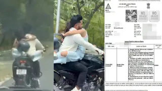 couples-romantic-stunt-on-moving-bike-goes-viral-noida-police-slaps-fine-worth-rs-53500