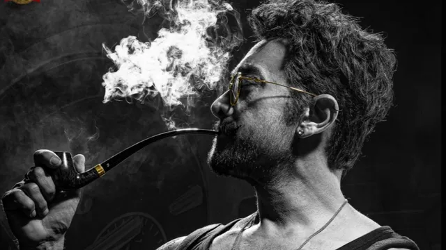 aamir-khan-intense-first-look-from-coolie-out-actor-flaunts-tattooed-bicep-while-smoking-cigar