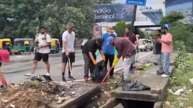 foreigners-living-in-gurgaon-clean-roads-and-drains-viral-video-sparks-backlash-as-netizens-call-it-shameful