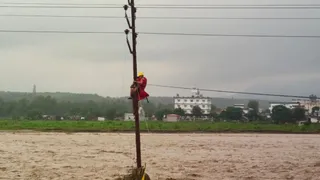 Dehradun Flash Floods: NDRF Saves Child Stranded On Electric Pole Amid Ravaging Waters | Watch