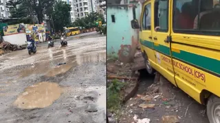 bengaluru-news-school-van-got-stuck-in-an-open-drain-at-panathur-bellandur-road-watch-video