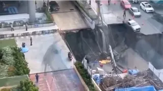 giant-bangkok-sinkhole-opens-near-police-station-swallows-vehicles-power-poles-viral-video
