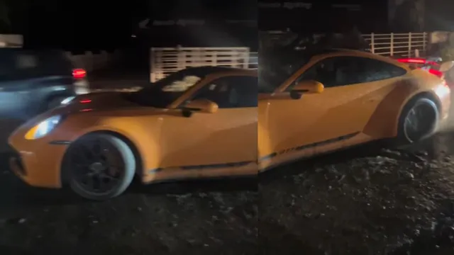 watch-viral-video-shows-porsche-911-carrera-worth-rs-2-crore-stuck-in-pothole-in-kerala