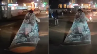 Rajasthan Man Rides Bike Wrapped In Blanket Like A Cape To Fight Freezing Cold | Video Goes Viral