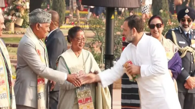 republic-day-2026-rahul-gandhis-gamosa-behind-latest-congress-vs-bjp-lop-patka-president-themed-in-house-reception