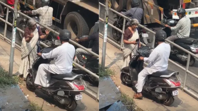 elderly-kerala-woman-blocks-moving-scooter-on-footpath-forces-rider-to-follow-road-rules-in-viral-video