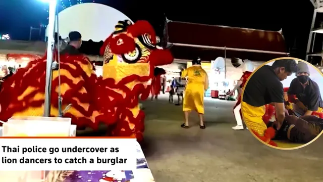 thai-police-disguised-as-lion-dance-performers-arrested-a-burglary-suspect-at-a-temple-fair-video