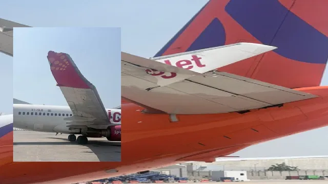 two-planes-collide-at-delhi-airport-part-of-spicejet-aircrafts-wing-stuck-into-another-plane-akasa-tail-video
