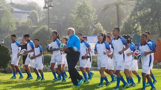 pm-modi-plays-football-with-youngsters-in-sikkim-gangtok-x-photos