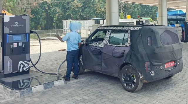upcoming-kia-syros-ev-spied-at-charging-station-ahead-of-launch-adas-500-km-range-and-more-expected