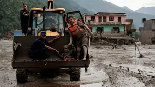 'I Tried To Grab My Wife's Hand, But She Was Swept Away By Mud': Race Against Time To Search For Nepal Floods Survivors